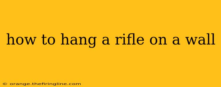 how to hang a rifle on a wall