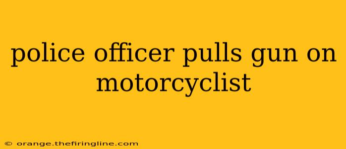 police officer pulls gun on motorcyclist